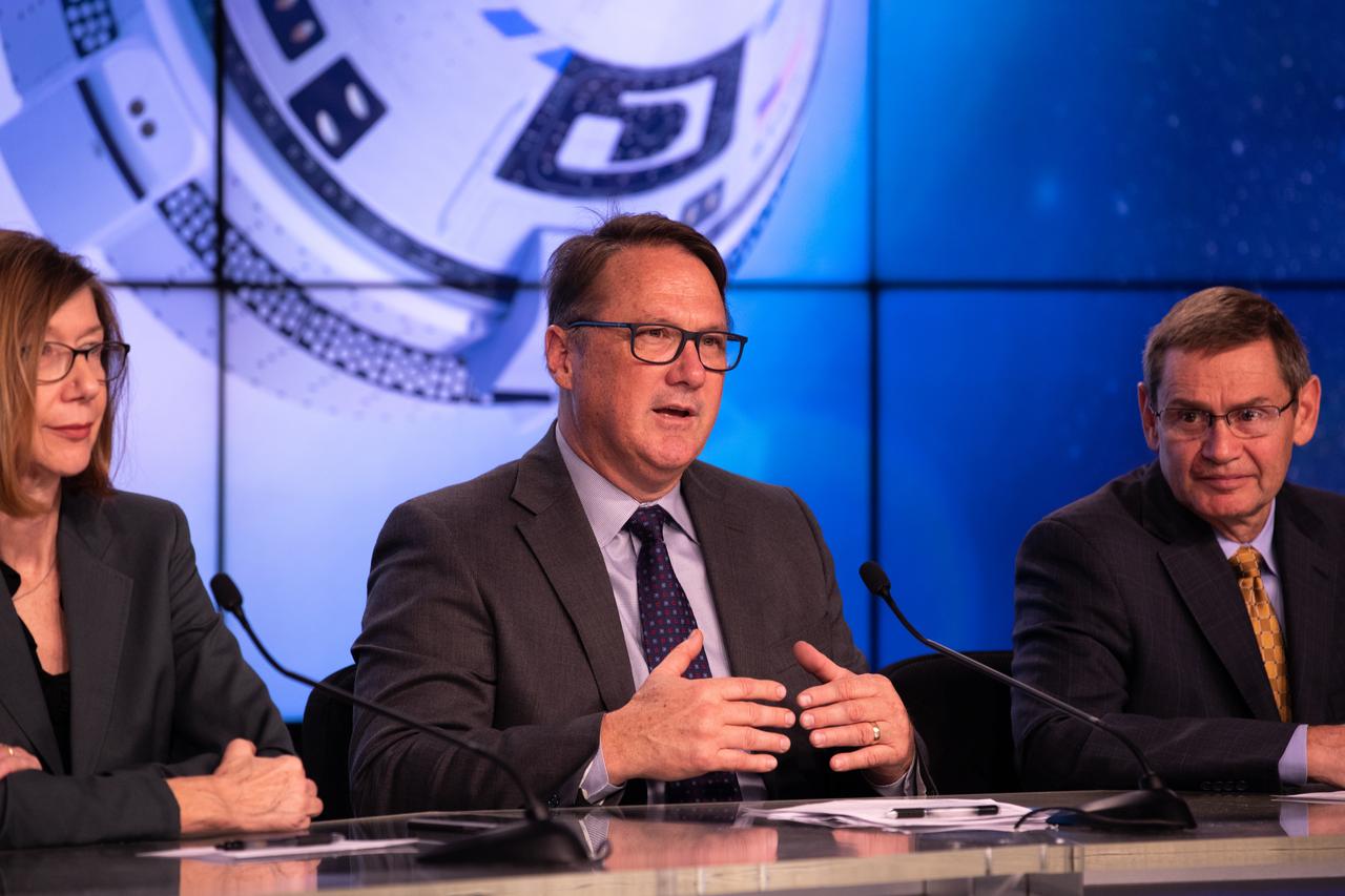 Officials from NASA, Boeing, United Launch Alliance and the U.S. Air Force 45th Weather Squadron participate in a prelaunch briefing for Boeing’s Orbital Flight Test at the agency’s Kennedy Space Center in Florida, Dec. 17, 2019. From left are Kathy Lueders, NASA Commercial Crew Program; John Mulholland, vice president and program manager, Boeing Commercial Crew Program; and John Elbon, chief operating officer, United Launch Alliance. Boeing’s CST-100 Starliner spacecraft will launch atop a United Launch Alliance Atlas V rocket from Space Launch Complex 41 at Cape Canaveral Air Force Station. The uncrewed Orbital Flight Test will be the Starliner’s first flight to the International Space Station for NASA’s Commercial Crew Program.