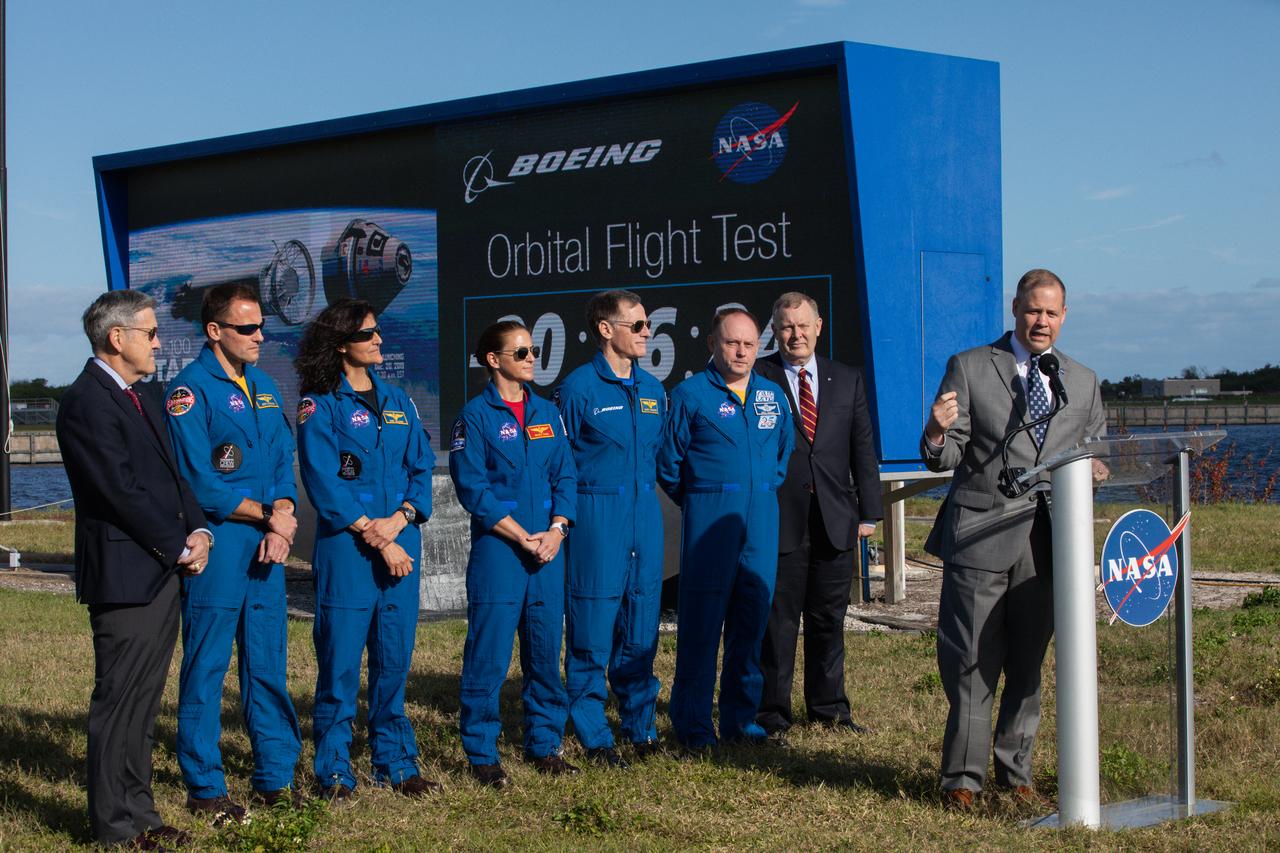 NASA Administrator Jim Bridenstine, Kennedy Space Center Director Bob Cabana, and astronauts representing NASA and Boeing participate in a Boeing Orbital Flight Test media briefing near the countdown clock at the Florida spaceport on Dec. 19, 2019. From left to right are Cabana; NASA astronauts Josh Cassada, Suni Williams and Nicole Mann; Boeing astronaut Chris Ferguson; NASA astronaut Mike Finke; NASA Deputy Administrator Jim Morhard; and Bridenstine. Boeing’s CST-100 Starliner spacecraft will launch atop a United Launch Alliance Atlas V rocket from Space Launch Complex 41 at Cape Canaveral Air Force Station. The uncrewed Orbital Flight Test will be the Starliner’s first flight to the International Space Station for NASA’s Commercial Crew Program. 