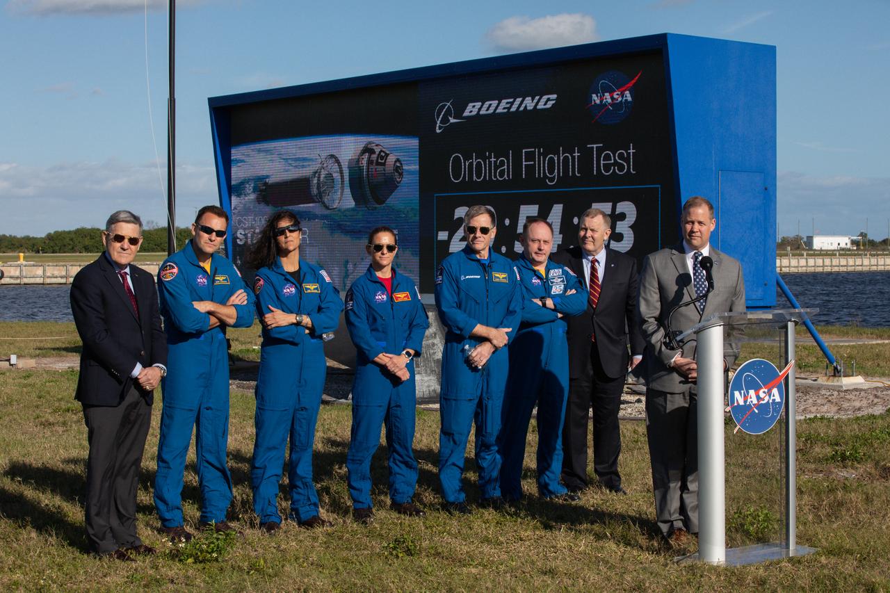 NASA Administrator Jim Bridenstine, Kennedy Space Center Director Bob Cabana, and astronauts representing NASA and Boeing participate in a Boeing Orbital Flight Test media briefing near the countdown clock at the Florida spaceport on Dec. 19, 2019. From left to right are Cabana; NASA astronauts Josh Cassada, Suni Williams and Nicole Mann; Boeing astronaut Chris Ferguson; NASA astronaut Mike Finke; NASA Deputy Administrator Jim Morhard; and Bridenstine. Boeing’s CST-100 Starliner spacecraft will launch atop a United Launch Alliance Atlas V rocket from Space Launch Complex 41 at Cape Canaveral Air Force Station. The uncrewed Orbital Flight Test will be the Starliner’s first flight to the International Space Station for NASA’s Commercial Crew Program. 