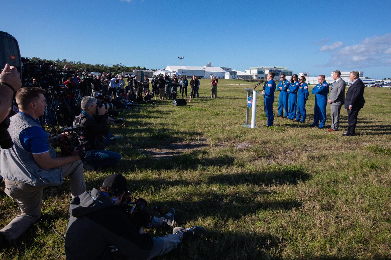 Chris Ferguson, Boeing astronaut, participates in a Boeing Orbital Flight Test media briefing near the countdown clock at the Florida spaceport on Dec. 19, 2019. In the background from left to right are Kennedy Space Center Director Bob Cabana; NASA astronauts Josh Cassada, Suni Williams, Nicole Mann and Mike Finke; NASA Administrator Jim Bridenstine; and Deputy Administrator Jim Morhard. Boeing’s CST-100 Starliner spacecraft will launch atop a United Launch Alliance Atlas V rocket from Space Launch Complex 41 at Cape Canaveral Air Force Station. The uncrewed Orbital Flight Test will be the Starliner’s first flight to the International Space Station for NASA’s Commercial Crew Program. 