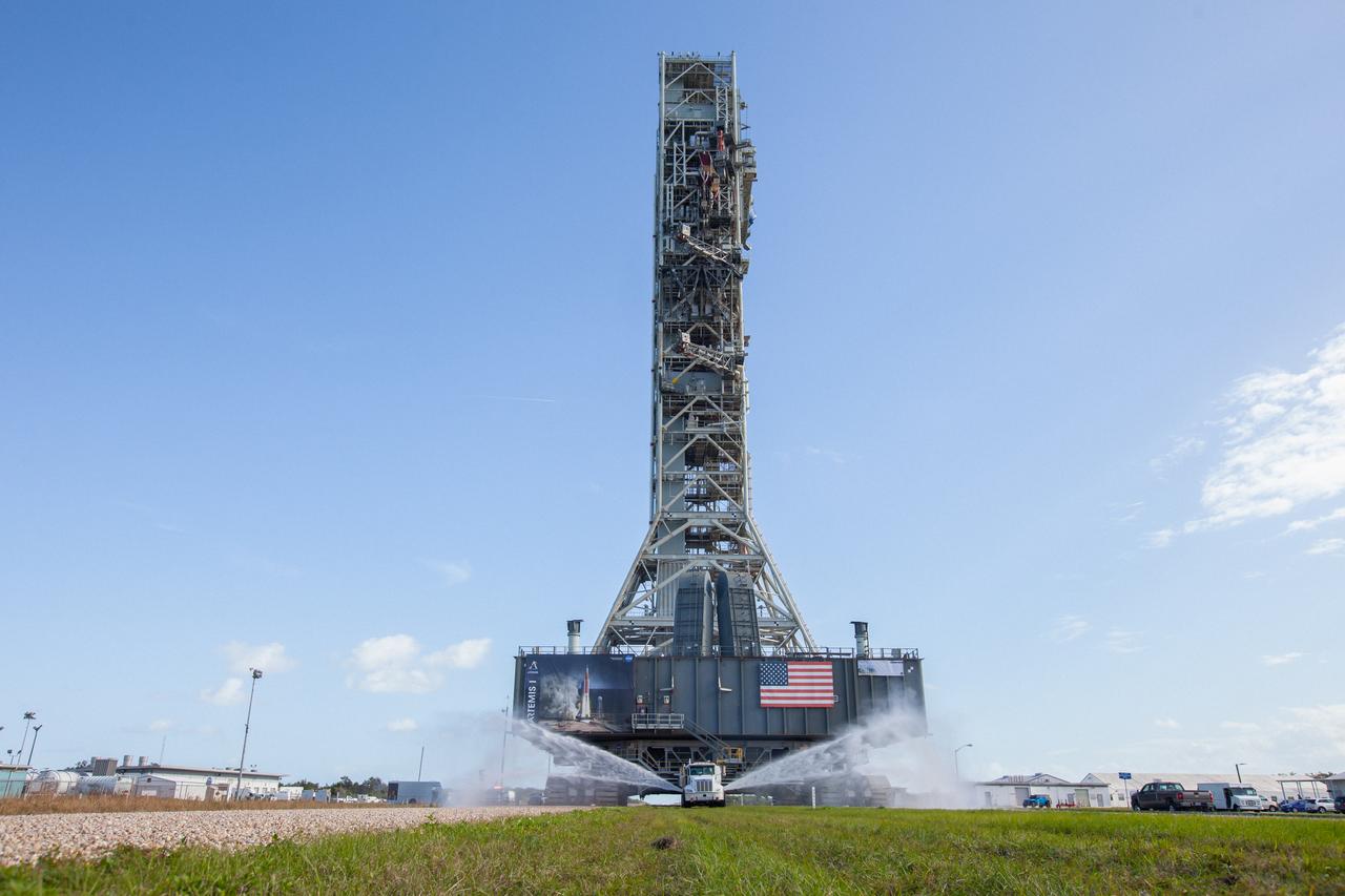 NASA’s mobile launcher, carried atop the crawler-transporter 2, returns to the Vehicle Assembly Building (VAB) on Dec. 20, 2019, after spending months at Launch Pad 39B undergoing final validation and verification testing at the agency’s Kennedy Space Center in Florida. Standing 380 feet tall, the mobile launcher – which will be used to assemble, process and launch the Space Launch System and Orion spacecraft – will remain inside the VAB until it is ready to return to the pad with the rocket and spacecraft on top for the “wet dress rehearsal” ahead of the Artemis I launch. 