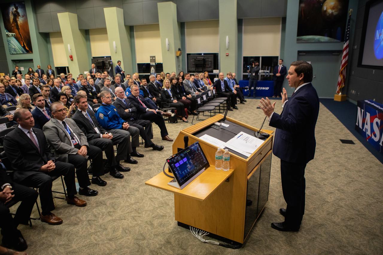 Florida Governor Ron DeSantis speaks to invited guests at NASA’s Kennedy Space Center in Florida during a prelaunch briefing for Boeing’s uncrewed Orbital Flight Test, Dec. 20, 2019. A United Launch Alliance Atlas V rocket carrying Boeing’s CST-100 Starliner spacecraft launched at 6:36 a.m. EST from Space Launch Complex 41 at Florida’s Cape Canaveral Air Force Station. The Orbital Flight Test is the Starliner’s first flight for NASA’s Commercial Crew Program.