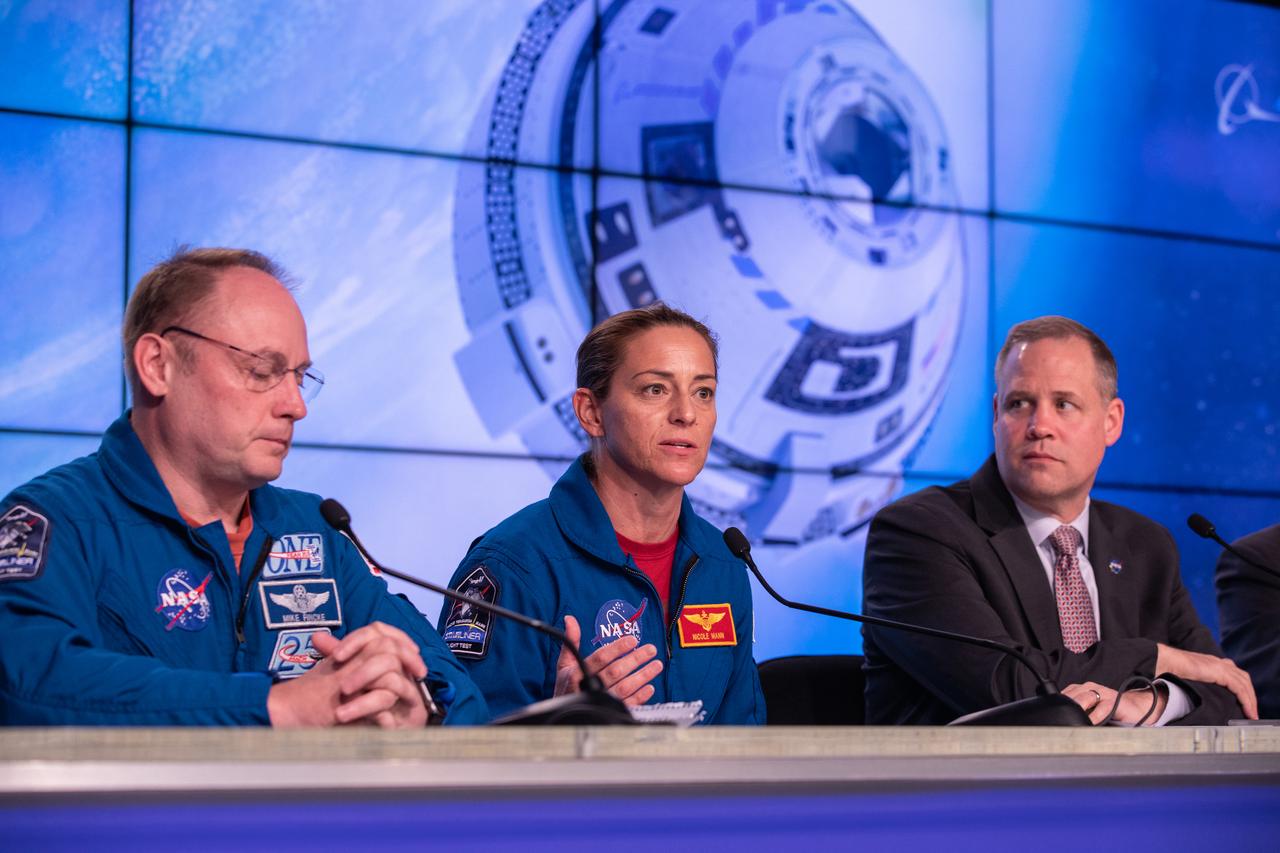 NASA astronaut Nicole Mann speaks during a briefing at the agency’s Kennedy Space Center in Florida following launch of Boeing’s Orbital Flight Test, Dec. 20, 2019. Beside her are NASA astronaut Mike Fincke, left, and NASA Administrator Jim Bridenstine. Boeing’s CST-100 Starliner spacecraft launched atop a United Launch Alliance Atlas V rocket from Space Launch Complex 41 at Cape Canaveral Air Force Station at 6:36 a.m. EST. The uncrewed Orbital Flight Test is the Starliner’s first flight for NASA’s Commercial Crew Program.