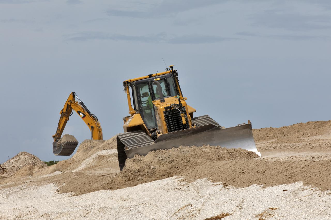 Restoration efforts are underway to the dunes at the north beaches at NASA’s Kennedy Space Center in Florida on Oct. 8, 2018. About 450,000 cubic yards of beach-quality sand, tested for compatibility, is being transported to the space center’s beaches. Once the dune is built up, native coastal vegetation will be replanted, helping to stabilize the dune and offer a habitat for Kennedy’s coast wildlife. Dunes are affected by beach erosion and storm surge from tropical events, such as hurricanes. Restoration began in spring 2018 and is targeted to be completed by April 2019.
