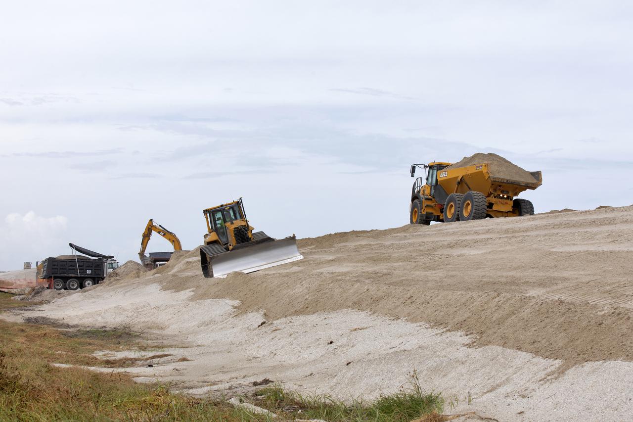 Restoration efforts are underway to the dunes at the north beaches at NASA’s Kennedy Space Center in Florida on Oct. 8, 2018. About 450,000 cubic yards of beach-quality sand, tested for compatibility, is being transported to the space center’s beaches. One the dune is built up, native coastal vegetation will be replanted, helping to stabilize the dune and offer a habitat for Kennedy’s coast wildlife. Dunes are affected by beach erosion and storm surge from tropical events, such as hurricanes. Restoration began in spring 2018 and is targeted to be completed by April 2019.