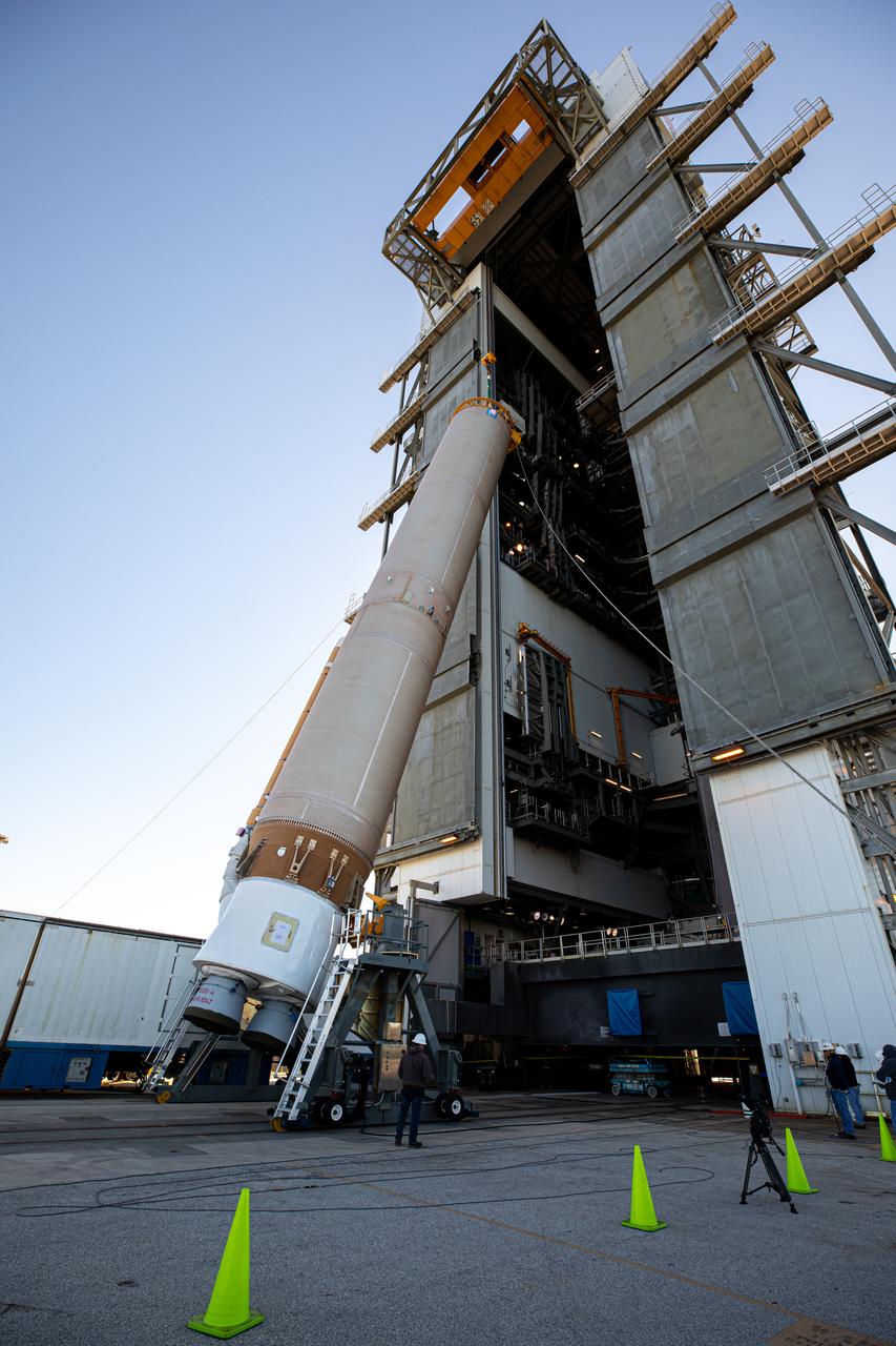 The booster of a United Launch Alliance Atlas V rocket that will launch the Solar Orbiter spacecraft is lifted into the vertical position at the Vertical Integration Facility near Space Launch Complex 41 at Cape Canaveral Air Force Station in Florida on Jan. 6, 2020. Solar Orbiter is an international cooperative mission between ESA (European Space Agency) and NASA. The mission aims to study the Sun, its outer atmosphere and solar wind. The spacecraft will provide the first images of the Sun’s poles. NASA’s Launch Services Program based at Kennedy Space Center in Florida is managing the launch.