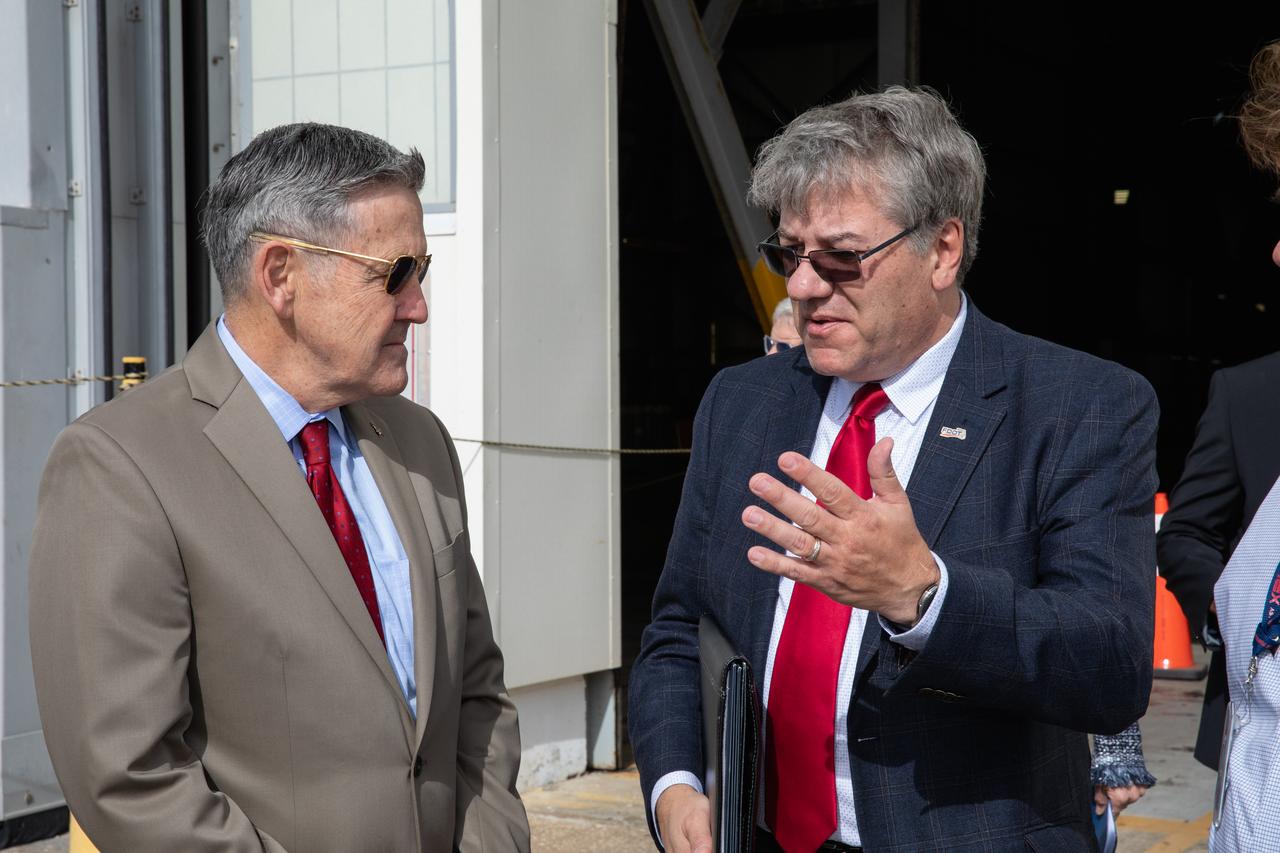 Kennedy Space Center Director Bob Cabana, left, talks with Florida Department of Transportation Secretary Kevin Thibault during a ceremony on Jan. 10, 2020, to recognize the Vehicle Assembly Building with the National Historic Civil Engineering Landmark award. The Florida Section American Society of Civil Engineers nominated the historic building and bestowed the award. The VAB is the first building at Kennedy Space Center to earn this distinction. At the time of its completion, the 129-million-cubic-foot structure was the largest building in the world. Originally designed and built to accommodate the Saturn V/Apollo used in Project Apollo, the VAB was later modified for its role in the Space Shuttle Program. 