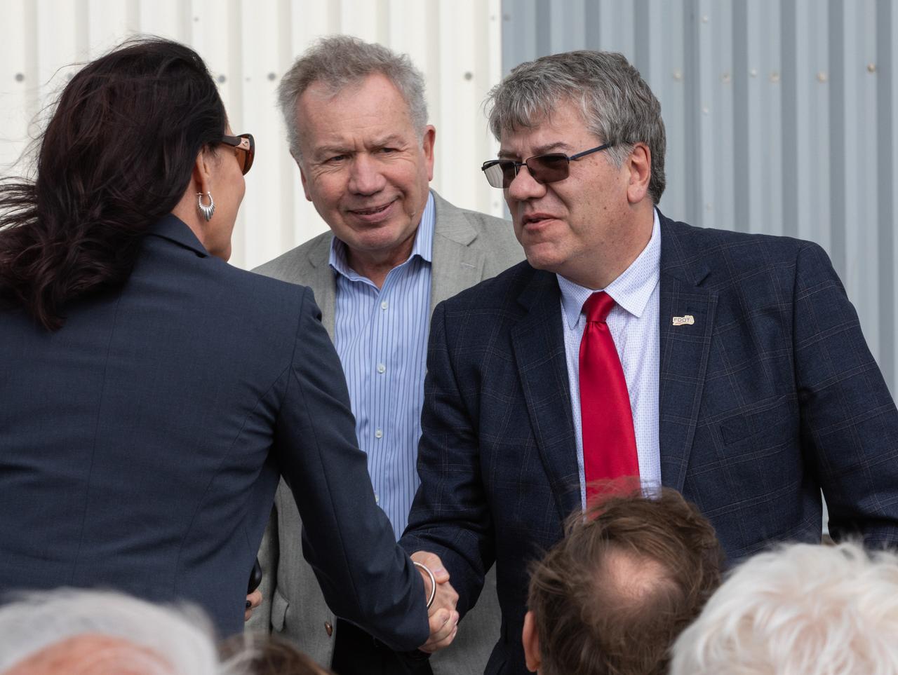 Florida Department of Transportation Secretary Kevin Thibault shakes hands with an attendee during a ceremony on Jan. 10, 2020, to recognize the Vehicle Assembly Building with the National Historic Civil Engineering Landmark award. The Florida Section American Society of Civil Engineers (ASCE) nominated the historic building and bestowed the award. Standing next to Thibault is Glenn Bell, ASCE Society of Structural Engineering Institute president. The VAB is the first building at Kennedy Space Center to earn this distinction. At the time of its completion, the 129-million-cubic-foot structure was the largest building in the world. Originally designed and built to accommodate the Saturn V/Apollo used in Project Apollo, the VAB was later modified for its role in the Space Shuttle Program.
