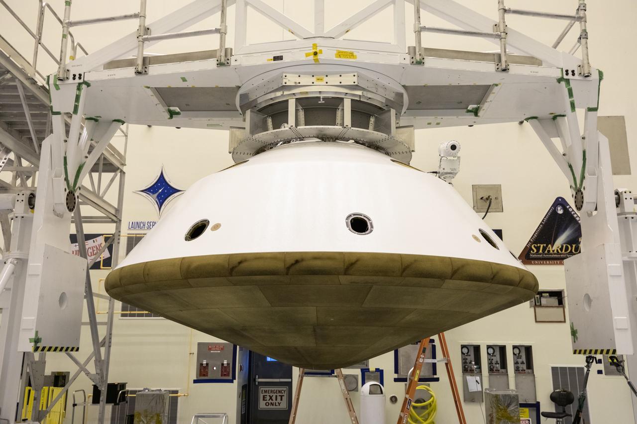The Mars 2020 rover heat shield is mated to the back shell in the Payload Hazardous Servicing Facility at Kennedy Space Center in Florida on Jan. 10, 2020. Built by Lockheed Martin Space, the heat shield and back shell will protect the rover during its passage to Mars. The Mars 2020 rover is being manufactured at NASA’s Jet Propulsion Laboratory (JPL) in California and, once complete, will be delivered to Kennedy next month. The mission is scheduled to launch from Cape Canaveral Air Force Station in Florida in the summer of 2020.