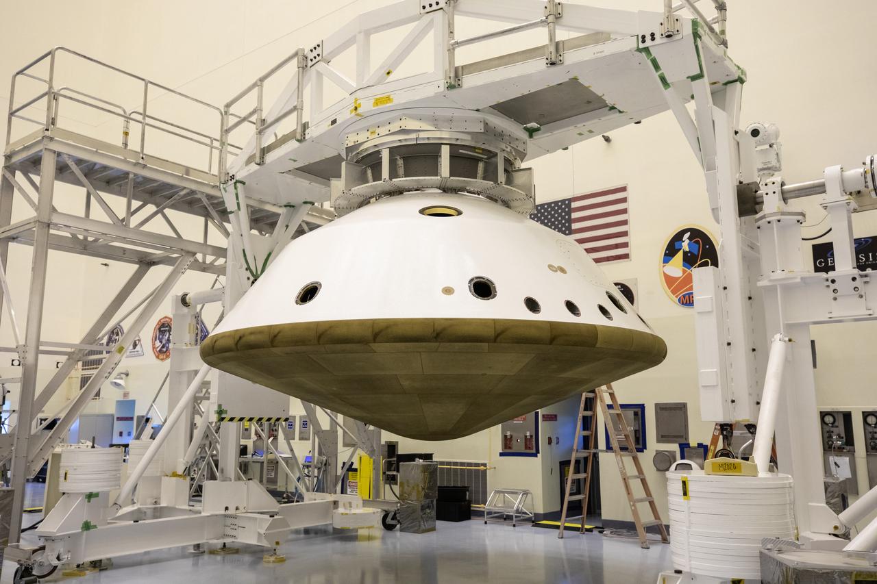 The Mars 2020 rover heat shield is mated to the back shell in the Payload Hazardous Servicing Facility at Kennedy Space Center in Florida on Jan. 10, 2020. Built by Lockheed Martin Space, the heat shield and back shell will protect the rover during its passage to Mars. The Mars 2020 rover is being manufactured at NASA’s Jet Propulsion Laboratory (JPL) in California and, once complete, will be delivered to Kennedy next month. The mission is scheduled to launch from Cape Canaveral Air Force Station in Florida in the summer of 2020.