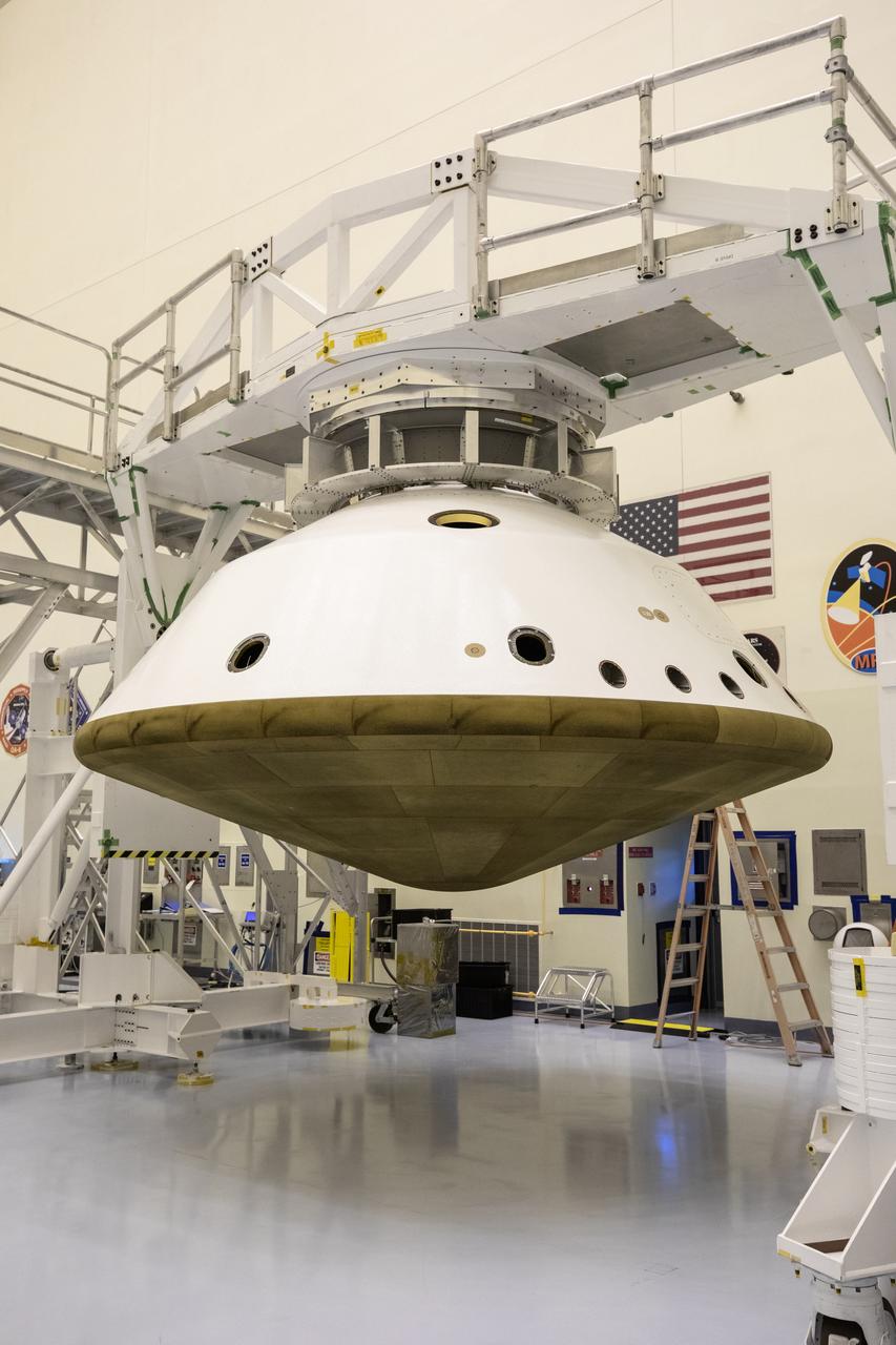 The Mars 2020 rover heat shield is mated to the back shell in the Payload Hazardous Servicing Facility at Kennedy Space Center in Florida on Jan. 10, 2020. Built by Lockheed Martin Space, the heat shield and back shell will protect the rover during its passage to Mars. The Mars 2020 rover is being manufactured at NASA’s Jet Propulsion Laboratory (JPL) in California and, once complete, will be delivered to Kennedy next month. The mission is scheduled to launch from Cape Canaveral Air Force Station in Florida in the summer of 2020.