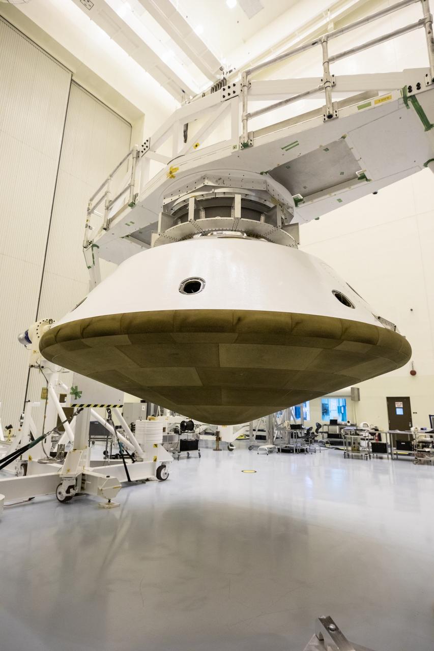 The Mars 2020 rover heat shield is mated to the back shell in the Payload Hazardous Servicing Facility at Kennedy Space Center in Florida on Jan. 10, 2020. Built by Lockheed Martin Space, the heat shield and back shell will protect the rover during its passage to Mars. The Mars 2020 rover is being manufactured at NASA’s Jet Propulsion Laboratory (JPL) in California and, once complete, will be delivered to Kennedy next month. The mission is scheduled to launch from Cape Canaveral Air Force Station in Florida in the summer of 2020.