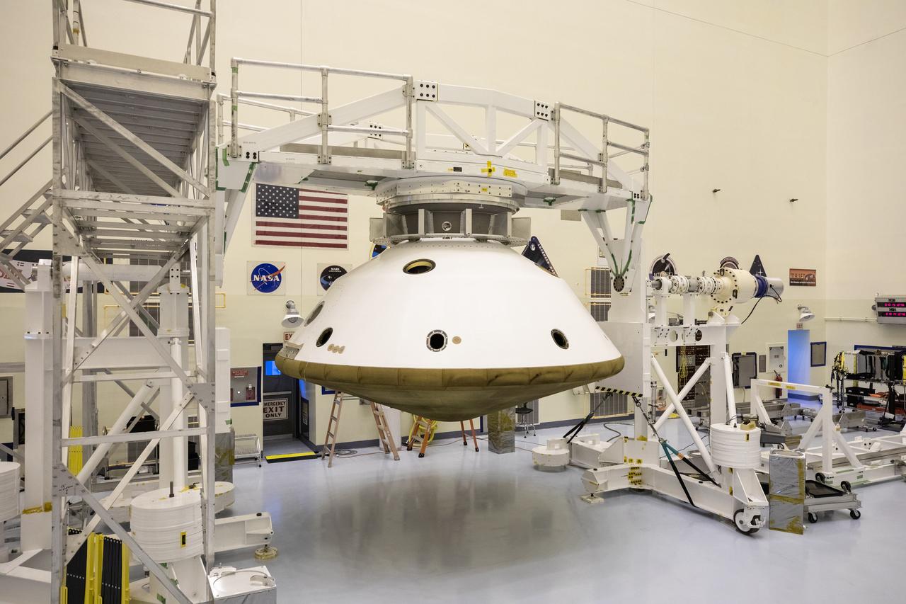 The Mars 2020 rover heat shield is mated to the back shell in the Payload Hazardous Servicing Facility at Kennedy Space Center in Florida on Jan. 10, 2020. Built by Lockheed Martin Space, the heat shield and back shell will protect the rover during its passage to Mars. The Mars 2020 rover is being manufactured at NASA’s Jet Propulsion Laboratory (JPL) in California and, once complete, will be delivered to Kennedy next month. The mission is scheduled to launch from Cape Canaveral Air Force Station in Florida in the summer of 2020.