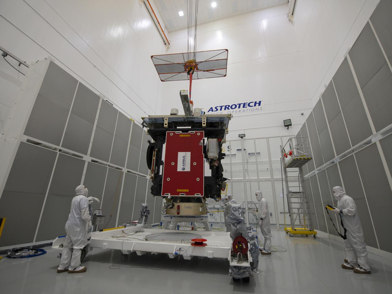 The Solar Orbiter spacecraft and payload adapter are lowered onto the ground transport vehicle inside Astrotech Space Operations in Titusville, Florida on Jan. 16, 2020. Solar Orbiter is an international cooperative mission between ESA (European Space Agency) and NASA. The mission aims to study the Sun, its outer atmosphere and solar wind. The spacecraft will provide the first images of the Sun’s poles. NASA’s Launch Services Program based at Kennedy is managing the launch. The spacecraft has been developed by Airbus Defence and Space. Solar Orbiter will launch in February 2020 aboard a United Launch Alliance Atlas V rocket from Space Launch Complex 41 at Cape Canaveral Air Force Station in Florida.