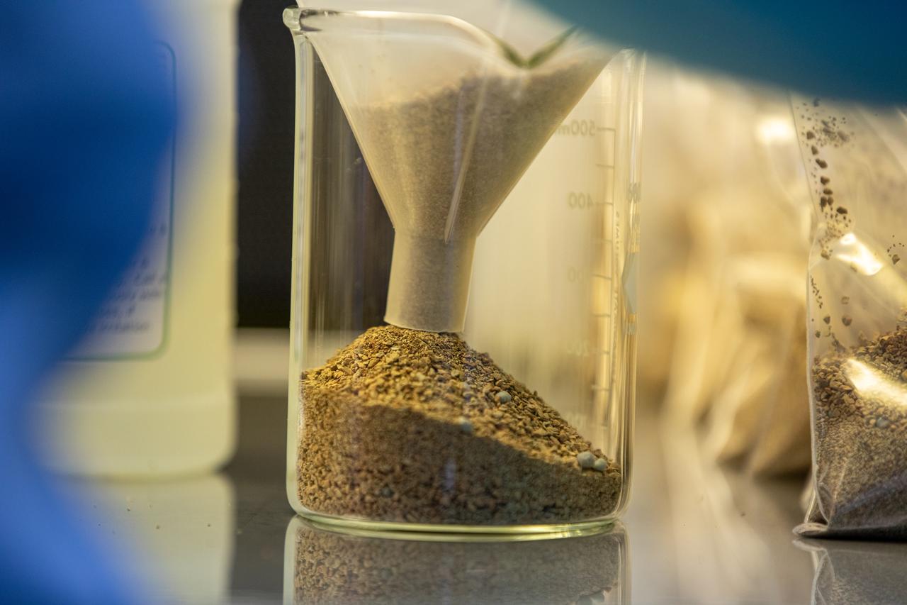 Inside the Space Station Processing Facility at NASA’s Kennedy Space Center in Florida, a researcher measures out the calcined clay that will be used to assemble plant pillows on Jan. 16, 2019. Often used to condition baseball infields, the clay’s size and roughness traps air and absorbs water to provide both to plant roots in microgravity. The pillows are small containers used to grow plants in space aboard the International Space Station. These pillows are for a series of plant experiments called VEG-03 J/K/L that will monitor the growth of three types of leafy greens and test a new way of handling seeds. The experiments will be launched to the orbiting laboratory aboard a Northrop Grumman Antares rocket and Cygnus spacecraft on the company’s 13th resupply services mission. Liftoff is scheduled for Feb. 9, 2020, at 5:39 p.m. EST from the agency’s Wallops Flight Facility in Virginia. 