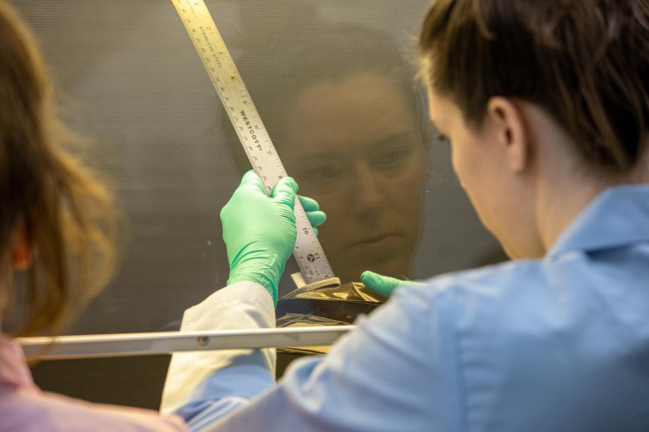 Jess Bunchek, a pseudonaut and associate scientist at NASA’s Kennedy Space Center, measures the seed wick emerging from a plant pillow in the Florida spaceport’s Space Station Processing Facility on Jan. 16, 2019. Researchers will then glue seeds onto the wick. A common method used to grow plants in space, the pillows are being sent to the International Space Station for a series of VEG-03 experiments that will study the growth of three types of leafy greens in a microgravity environment and test a new way of handling seeds. The experiments will be launched to the orbiting laboratory aboard a Northrop Grumman Antares rocket and Cygnus spacecraft on the company’s 13th resupply services mission. Liftoff is scheduled for Feb. 9, 2020, at 5:39 p.m. EST from the agency’s Wallops Flight Facility in Virginia. 
