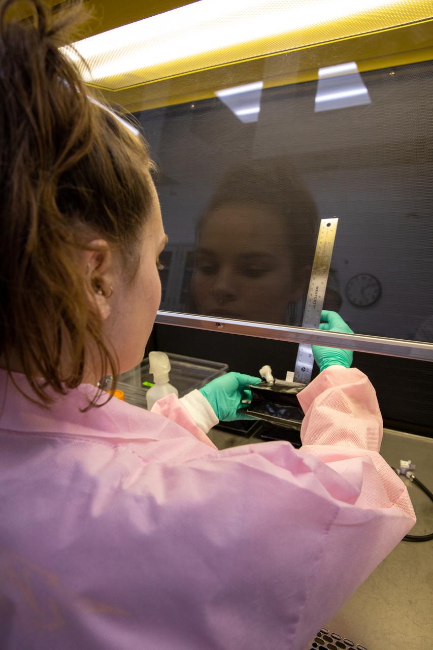 Emily Kennebeck, an intern at NASA’s Kennedy Space Center in Florida, measures the seed wick emerging from a plant pillow in the Space Station Processing Facility on Jan. 16, 2019. Researchers will glue seeds for two crops onto the wicks. A common method used to grow plants in space, the pillows are being sent to the International Space Station for a series of VEG-03 experiments that will study the growth of three types of leafy greens in a microgravity environment and a new seed handling material. The experiments will be launched to the orbiting laboratory aboard a Northrop Grumman Antares rocket and Cygnus spacecraft on the company’s 13th resupply services mission. Liftoff is scheduled for Feb. 9, 2020, at 5:39 p.m. EST from the agency’s Wallops Flight Facility in Virginia.