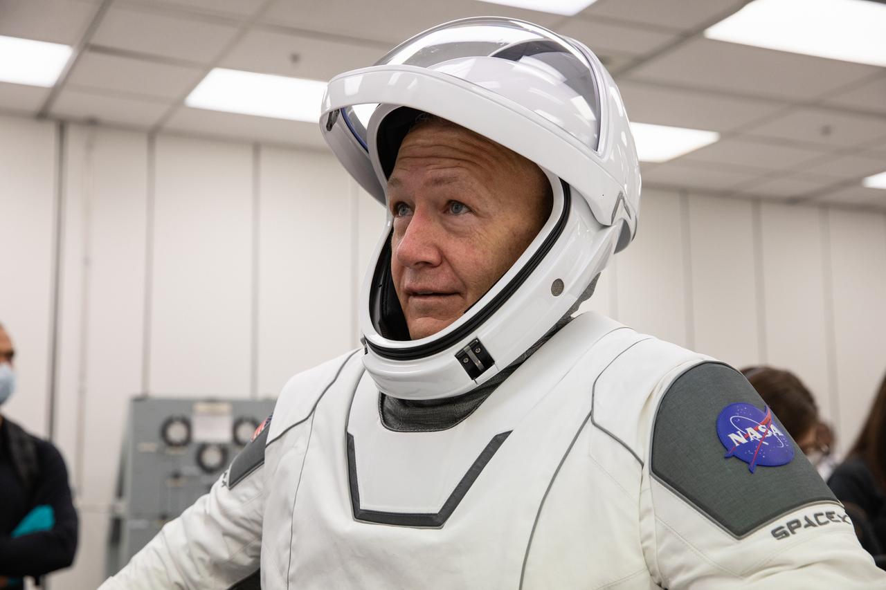 NASA astronaut Doug Hurley dons a SpaceX spacesuit in the Astronaut Crew Quarters at Kennedy Space Center in Florida on Jan. 17, 2020, during a dress rehearsal ahead of the company’s uncrewed In-Flight Abort Test. A SpaceX Falcon 9 rocket and Crew Dragon spacecraft will lift off from Launch Complex 39A on the flight test, which will demonstrate the spacecraft’s escape capabilities in preparation for crewed flights to the International Space Station as part of the agency’s Commercial Crew Program. Hurley and NASA astronaut Bob Behnken are slated to fly on the company’s first crewed mission, Demo-2.