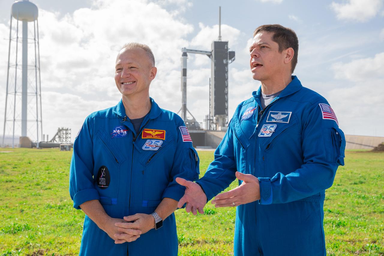 NASA astronauts Doug Hurley, left, and Bob Behnken stand near Launch Pad 39A at the agency’s Kennedy Space Center in Florida on Jan. 17, 2020, during a dress rehearsal ahead of the SpaceX uncrewed In-Flight Abort Test. In the background, the company’s Falcon 9 rocket is topped by the Crew Dragon spacecraft. The flight test will demonstrate the spacecraft’s escape capabilities in preparation for crewed flights to the International Space Station as part of the agency’s Commercial Crew Program. Hurley and Behnken are slated to fly on the company’s first crewed mission, Demo-2.