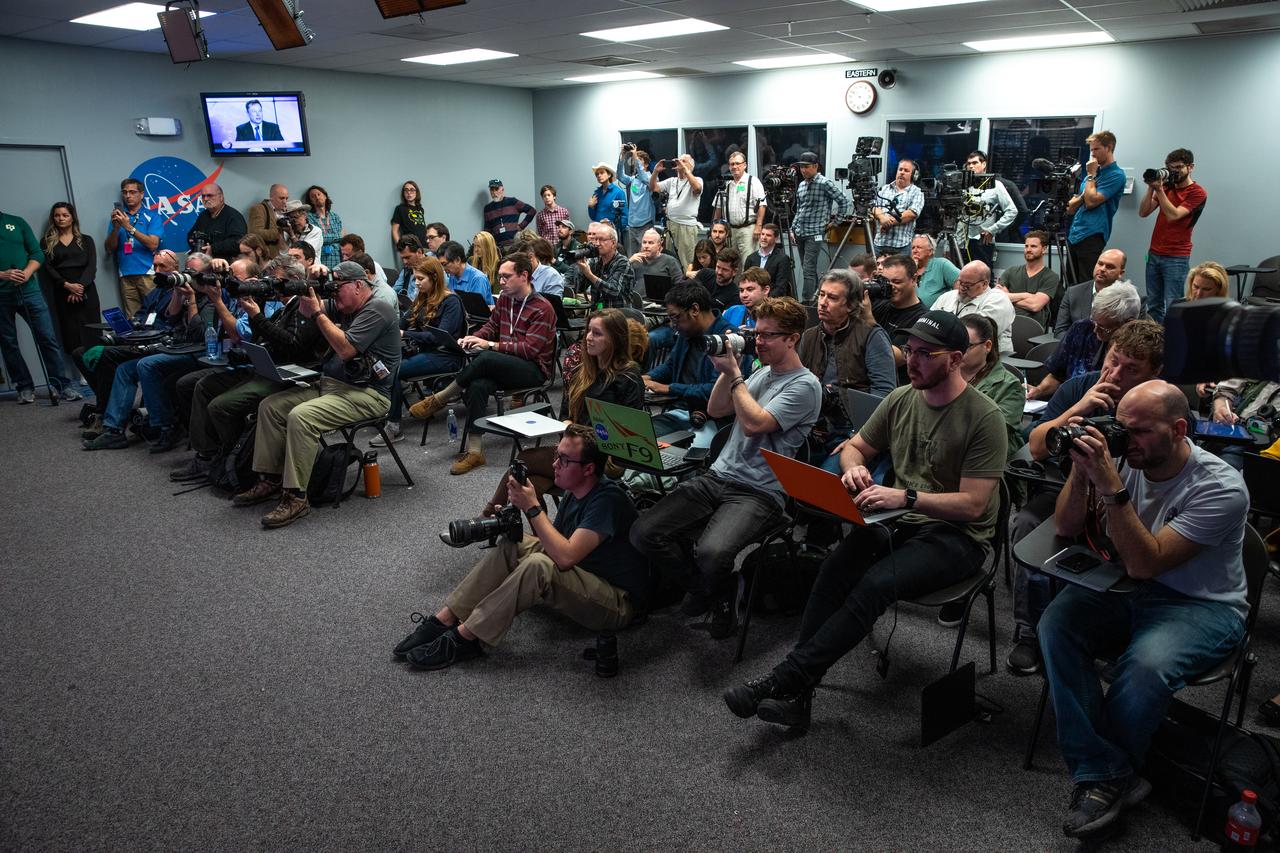 Members of the news media listen as officials from NASA and SpaceX participate in a briefing at the agency’s Kennedy Space Center in Florida following the company’s uncrewed In-Flight Abort Test on Jan. 19, 2020. During the flight test, a SpaceX Falcon 9 rocket and Crew Dragon spacecraft lifted off from Kennedy’s Launch Complex 39A and began a planned launch-abort sequence demonstrating the spacecraft’s escape capabilities. The Crew Dragon splashed down in the Atlantic Ocean as expected. The In-Flight Abort Test is a critical milestone in preparation for crewed flights to the International Space Station as part of the agency’s Commercial Crew Program.