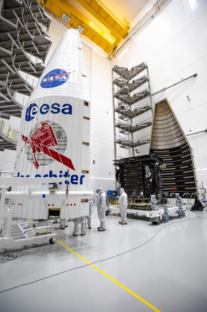 Both halves of a United Launch Alliance Atlas V payload fairing are positioned for installation around the Solar Orbiter spacecraft inside the Astrotech Space Operations facility in Titusville, Florida, on Jan. 20, 2020. The fairing provides a protective, aerodynamic covering to the payload inside during the early minutes of ascent. Solar Orbiter is an international cooperative mission between ESA (European Space Agency) and NASA. The mission aims to study the Sun, its outer atmosphere and solar wind. The spacecraft will provide the first images of the Sun’s poles. NASA’s Launch Services Program based at Kennedy Space Center in Florida is managing the launch. The spacecraft has been developed by Airbus Defence and Space. Solar Orbiter will launch aboard an Atlas V rocket from Space Launch Complex 41 at Cape Canaveral Air Force Station in Florida. Liftoff is scheduled for Feb. 5, 2020.