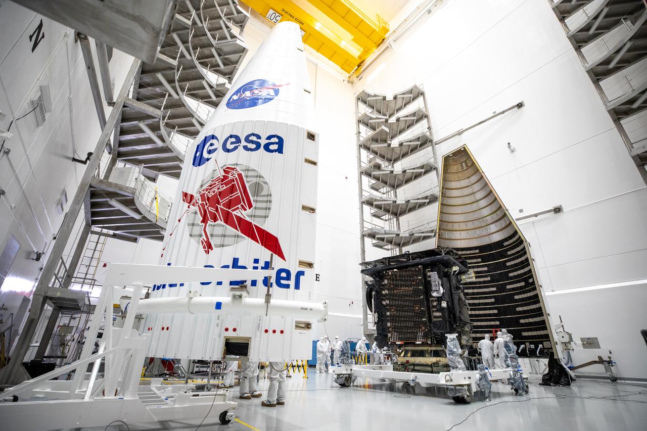 Both halves of a United Launch Alliance Atlas V payload fairing are positioned for installation around the Solar Orbiter spacecraft inside the Astrotech Space Operations facility in Titusville, Florida, on Jan. 20, 2020. The fairing provides a protective, aerodynamic covering to the payload inside during the early minutes of ascent. Solar Orbiter is an international cooperative mission between ESA (European Space Agency) and NASA. The mission aims to study the Sun, its outer atmosphere and solar wind. The spacecraft will provide the first images of the Sun’s poles. NASA’s Launch Services Program based at Kennedy Space Center in Florida is managing the launch. The spacecraft has been developed by Airbus Defence and Space. Solar Orbiter will launch aboard an Atlas V rocket from Space Launch Complex 41 at Cape Canaveral Air Force Station in Florida. Liftoff is scheduled for Feb. 5, 2020.