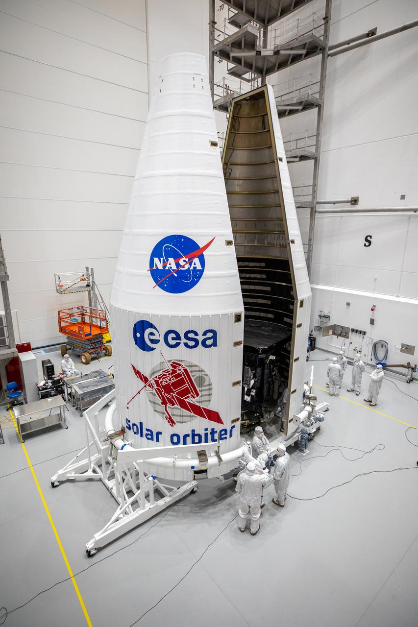 Both halves of a United Launch Alliance Atlas V payload fairing come together around the Solar Orbiter spacecraft inside the Astrotech Space Operations facility in Titusville, Florida, on Jan. 20, 2020. The fairing provides a protective, aerodynamic cover to the payload inside during the early minutes of ascent. Solar Orbiter is an international cooperative mission between ESA (European Space Agency) and NASA. The mission aims to study the Sun, its outer atmosphere and solar wind. The spacecraft will provide the first images of the Sun’s poles. NASA’s Launch Services Program based at Kennedy Space Center in Florida is managing the launch. The spacecraft has been developed by Airbus Defence and Space. Solar Orbiter will launch aboard an Atlas V rocket from Space Launch Complex 41 at Cape Canaveral Air Force Station in Florida. Liftoff is scheduled for Feb. 5, 2020.
