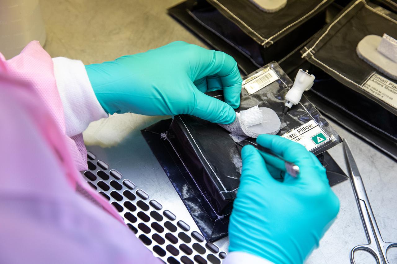 On Jan. 21, 2020, inside the Space Station Processing Facility at NASA’s Kennedy Space Center in Florida, intern Emily Kennebeck prepares plant pillows for their flight to the International Space Station. The pillows, which are a common method used to grow plants in space, are being sent to the orbiting laboratory on Northrop Grumman’s 13th resupply services (NG-13) mission for a series of VEG-03 experiments that will study the growth of three types of leafy greens in a microgravity environment. Once the pillows are assembled and packaged for flight, they will be transported to the agency’s Wallops Flight Facility in Virginia, where liftoff will occur. NG-13 is scheduled to launch on Feb. 9, 2020, at 5:39 p.m. EST. 