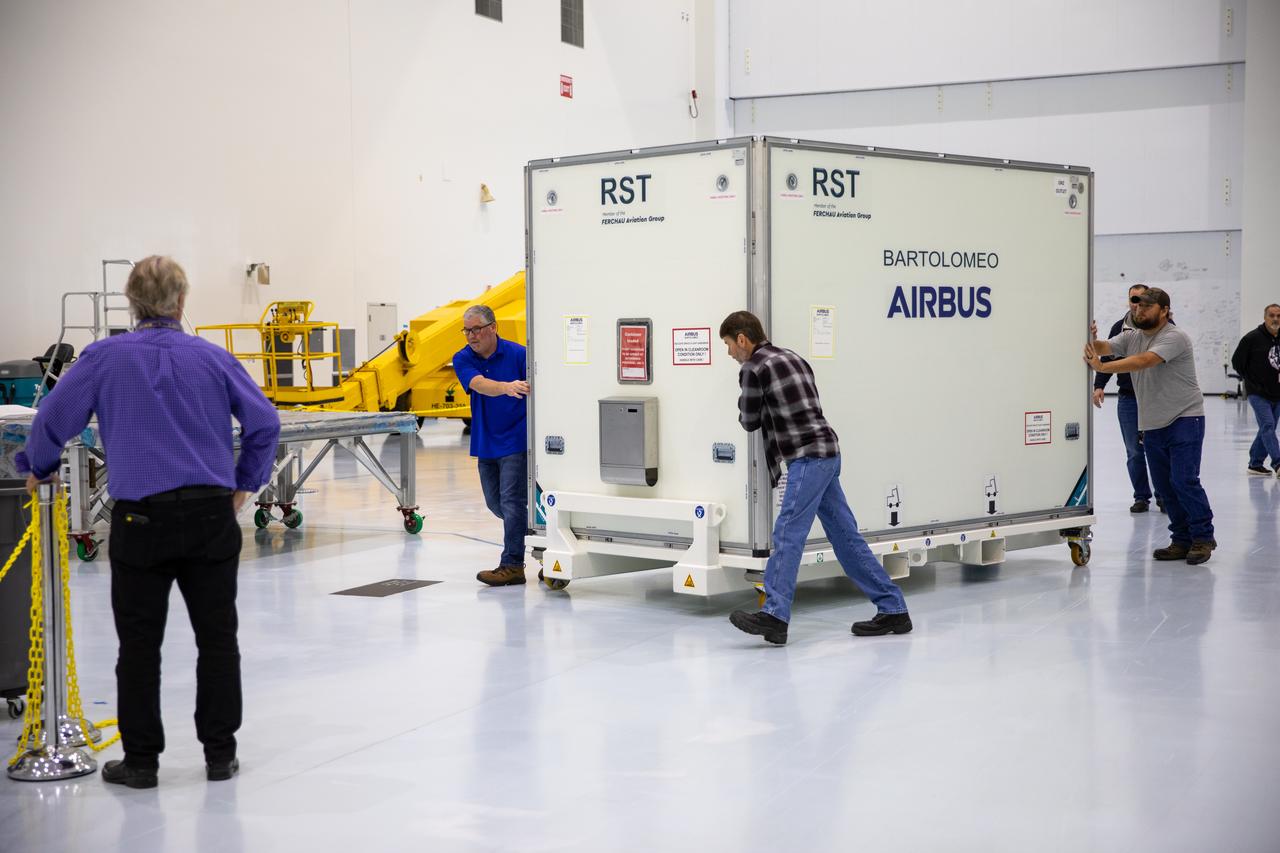The Bartolomeo platform that will be carried to the International Space Station aboard SpaceX’s 20th Commercial Resupply Services (CRS-20) mission for NASA is moved in its shipping container inside the Space Station Processing Facility high bay at the agency’s Kennedy Space Center in Florida on Jan. 30, 2020. Bartolomeo was manufactured by Airbus Defence and Space. The platform will attach to the exterior of the space station’s European Columbus Module. Named for the younger brother of Christopher Columbus, the platform has the capability to host external payloads in low-Earth orbit on the station. CRS-20 is scheduled to launch aboard SpaceX’s Dragon cargo spacecraft atop the company’s Falcon 9 rocket in March 2020.