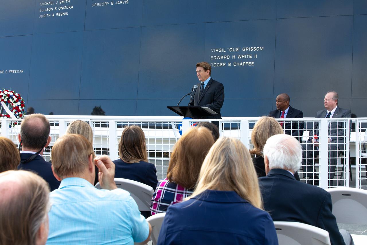 Astronauts Memorial Foundation president and CEO Thad Altman addresses the audience during the NASA Day of Remembrance ceremony at the Space Mirror Memorial in the Kennedy Space Center Visitor Complex on Jan. 30, 2020. Behind Altman, from left to right, are Kelvin Manning, Kennedy associate director, technical; and Burt Summerfield, associate director, management. The crews of Apollo 1 and space shuttles Challenger and Columbia, as well as other fallen astronauts who lost their lives in the name of space exploration and discovery, were honored at the annual event.