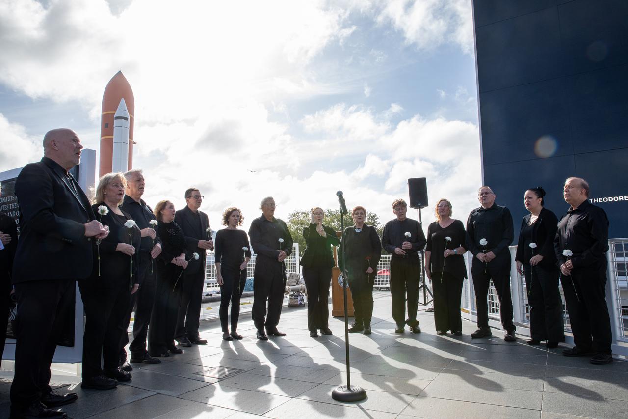 Members of the Space Coast Voices sing the National Anthem during the NASA Day of Remembrance ceremony at the Space Mirror Memorial in the Kennedy Space Center Visitor Complex on Jan. 30, 2020. The crews of Apollo 1 and space shuttles Challenger and Columbia, as well as other fallen astronauts who lost their lives in the name of space exploration and discovery, were honored at the annual event.