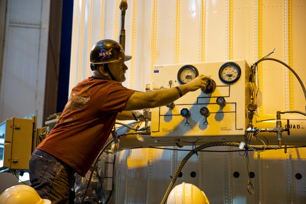 A worker prepares for mate operations of the Solar Orbiter spacecraft, contained inside the payload fairing, to the Atlas V rocket inside the Vertical Integration Facility at Space Launch Complex 41 on Cape Canaveral Air Force Station in Florida on Jan. 31, 2020. The payload fairing will be mated to the Atlas V rocket. Solar Orbiter is an international cooperative mission between ESA (European Space Agency) and NASA. The mission aims to study the Sun, its outer atmosphere and solar wind. The spacecraft will provide the first images of the Sun’s poles. NASA’s Launch Services Program based at Kennedy is managing the launch. The spacecraft has been developed by Airbus Defence and Space. Solar Orbiter will launch in February 2020 aboard the Atlas V rocket.