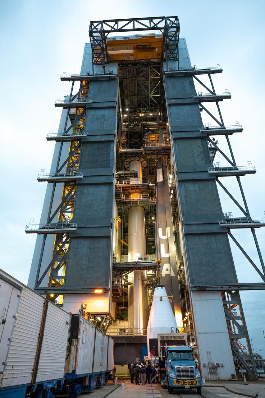 The United Launch Alliance Atlas V payload fairing, containing the Solar Orbiter spacecraft, is hoisted up by crane at the Vertical Integration Facility at Space Launch Complex 41 on Cape Canaveral Air Force Station in Florida on Jan. 31, 2020. The payload fairing will be mated to the Atlas V rocket. Solar Orbiter is an international cooperative mission between ESA (European Space Agency) and NASA. The mission aims to study the Sun, its outer atmosphere and solar wind. The spacecraft will provide the first images of the Sun’s poles. NASA’s Launch Services Program based at Kennedy is managing the launch. The spacecraft has been developed by Airbus Defence and Space. Solar Orbiter will launch in February 2020 aboard the Atlas V rocket.