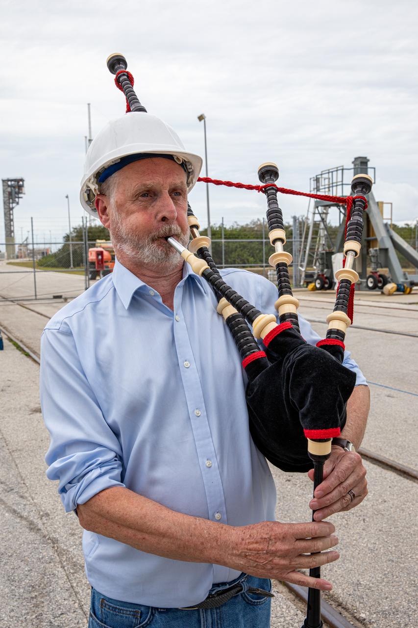 An Airbus Defence and Space worker plays the bagpipes at the Vertical Integration Facility at Space Launch Complex 41 on Cape Canaveral Air Force Station in Florida on Jan. 31, 2020. It is a tradition for the company to play the bagpipes during spacecraft mate to rocket. In the background, a crane lifts the United Launch Alliance payload fairing, containing the Solar Orbiter spacecraft, for mating to the company’s Atlas V rocket. Solar Orbiter is an international cooperative mission between ESA (European Space Agency) and NASA. The mission aims to study the Sun, its outer atmosphere and solar wind. The spacecraft will provide the first images of the Sun’s poles. NASA’s Launch Services Program based at Kennedy is managing the launch. The spacecraft has been developed by Airbus Defence and Space. Solar Orbiter will launch in February 2020 aboard the Atlas V rocket.
