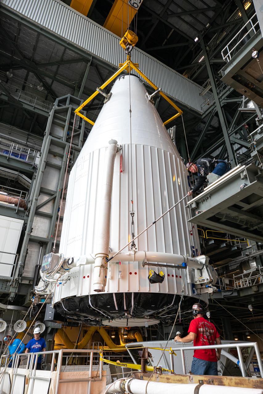 The United Launch Alliance Atlas V payload fairing, containing the Solar Orbiter spacecraft, is moved into the Vertical Integration Facility at Space Launch Complex 41 on Cape Canaveral Air Force Station in Florida on Jan. 31, 2020. The payload fairing will be lowered and mated to the Atlas V rocket. Solar Orbiter is an international cooperative mission between ESA (European Space Agency) and NASA. The mission aims to study the Sun, its outer atmosphere and solar wind. The spacecraft will provide the first images of the Sun’s poles. NASA’s Launch Services Program based at Kennedy is managing the launch. The spacecraft has been developed by Airbus Defence and Space. Solar Orbiter will launch in February 2020 aboard the Atlas V rocket.