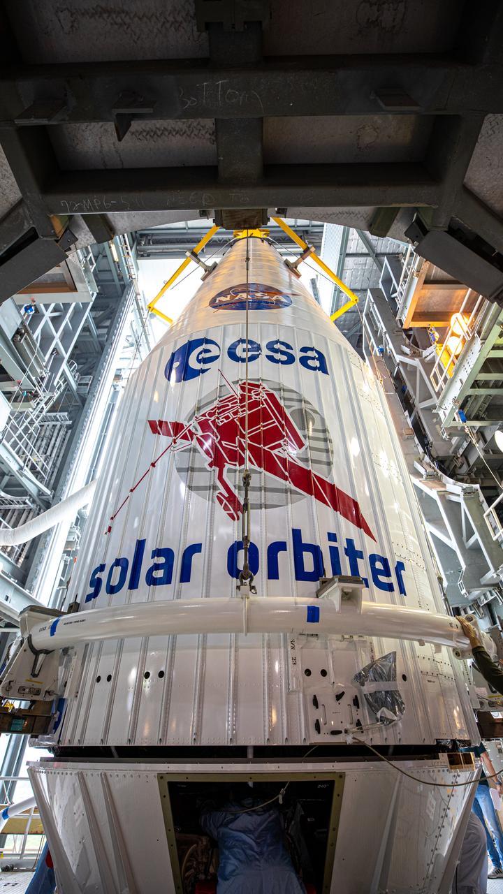 The United Launch Alliance Atlas V payload fairing, containing the Solar Orbiter spacecraft, is being secured on top of the company’s Atlas V rocket inside the Vertical Integration Facility at Space Launch Complex 41 on Cape Canaveral Air Force Station in Florida on Jan. 31, 2020. Solar Orbiter is an international cooperative mission between ESA (European Space Agency) and NASA. The mission aims to study the Sun, its outer atmosphere and solar wind. The spacecraft will provide the first images of the Sun’s poles. NASA’s Launch Services Program based at Kennedy is managing the launch. The spacecraft has been developed by Airbus Defence and Space. Solar Orbiter will launch in February 2020 aboard the Atlas V rocket.