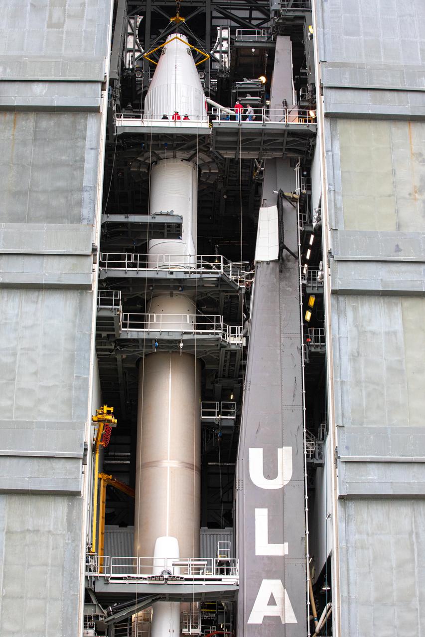 The United Launch Alliance Atlas V payload fairing, containing the Solar Orbiter spacecraft, is secured atop the company’s Atlas V rocket inside the Vertical Integration Facility at Space Launch Complex 41 on Cape Canaveral Air Force Station in Florida on Jan. 31, 2020. Solar Orbiter is an international cooperative mission between ESA (European Space Agency) and NASA. The mission aims to study the Sun, its outer atmosphere and solar wind. The spacecraft will provide the first images of the Sun’s poles. NASA’s Launch Services Program based at Kennedy is managing the launch. The spacecraft has been developed by Airbus Defence and Space. Solar Orbiter will launch in February 2020 aboard the Atlas V rocket.