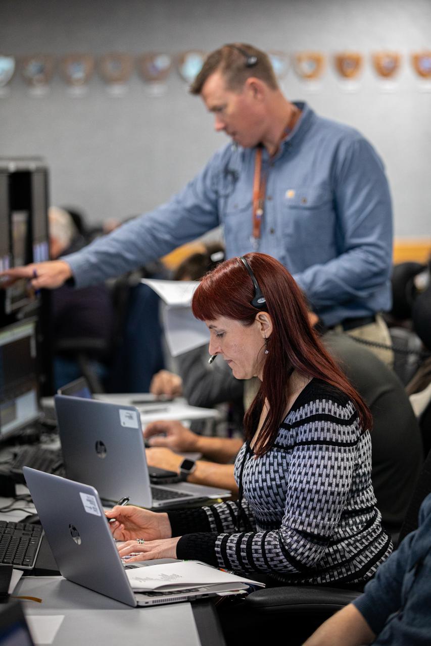 Colleen Huber (front) and Patrick Engel, hazardous gas engineers at NASA’s Kennedy Space Center in Florida, participate in a launch countdown simulation inside Firing Room 1 in the Launch Control Center on Feb. 3, 2020. Under the leadership of Launch Director Charlie Blackwell-Thompson, a team of nearly 100 engineers from Orion, Space Launch System (SLS) and NASA’s Exploration Ground Systems came together to work through a series of simulated challenges, as well as a final countdown procedure, in preparation for the Artemis I launch. During these exercises, different issues were introduced to familiarize the team with launch day operations, while providing them with an opportunity to practice how they would handle those issues in real-time. Artemis I will be the first integrated test flight of the Orion spacecraft and SLS rocket – the system that will ultimately land the first woman and the next man on the Moon. 