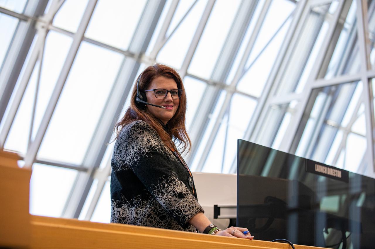 Artemis I Launch Director Charlie Blackwell-Thompson stands at her console inside the Launch Control Center’s Firing Room 1 at NASA’s Kennedy Space Center in Florida during launch countdown training. On Feb. 3, 2020, a team of nearly 100 engineers from Orion, Space Launch System (SLS) and the agency’s Exploration Ground Systems came together to work through a series of simulated challenges, as well as a final countdown procedure. During these exercises, different issues were introduced to familiarize the team with launch day operations, while providing them with an opportunity to practice how they would handle those issues in real-time. Artemis I will be the first integrated test flight of the Orion spacecraft and SLS rocket – the system that will ultimately land the first woman and the next man on the Moon. 