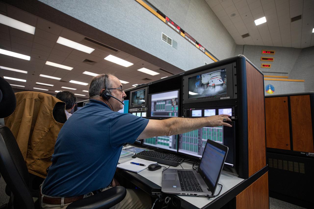 John McClelland, an engine controllers engineer at NASA’s Kennedy Space Center in Florida, participates in an Artemis I launch countdown simulation inside the Launch Control Center’s Firing Room 1. Under the leadership of Launch Director Charlie Blackwell-Thompson, nearly 100 engineers from Orion, Space Launch System (SLS) and the agency’s Exploration Ground Systems came together on Feb. 3, 2020, to work through a series of simulated challenges, as well as a final countdown procedure. During these exercises, different issues were introduced to familiarize the team with launch day operations, while providing them with an opportunity to practice how they would handle those issues in real-time. Artemis I will be the first integrated test flight of the Orion spacecraft and SLS rocket – the system that will ultimately land the first woman and the next man on the Moon. 