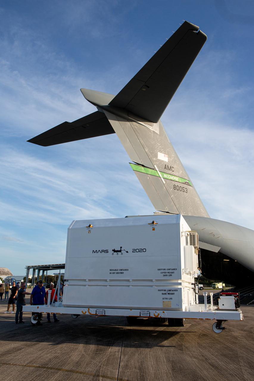 The Mars 2020 rover is pictured outside of the C-17 aircraft that delivered it to the Launch and Landing Facility, formerly known as the Shuttle Landing Facility, at NASA’s Kennedy Space Center in Florida on Feb. 12, 2020. The rover made a cross-country trip that started at NASA’s Jet Propulsion Laboratory in Pasadena, California. The mission, targeted for mid-July 2020, will launch aboard an Atlas V 541 rocket from Cape Canaveral Air Force Station. NASA’s Launch Services Program based at Kennedy is managing the launch.