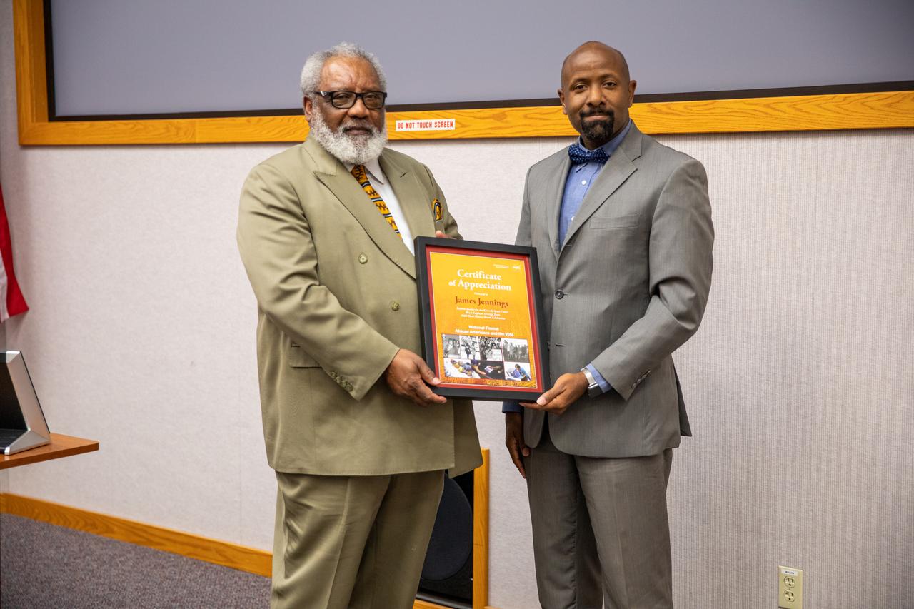 James Jennings, at left, former NASA associate administrator for Institutions and Management and former Kennedy Space Center deputy director, was the keynote speaker at the center’s Black History Month celebration on Feb. 18, 2020. He received a Certificate of Appreciation from the program’s organizer, the Black Employee Strategy Team (BEST), one of the center’s employee resource groups. At right is Martin Hayes, program analyst with Exploration Ground Systems and BEST chairperson. This year’s theme was “African Americans and the Vote.” Jennings shared advice with workers and managers.