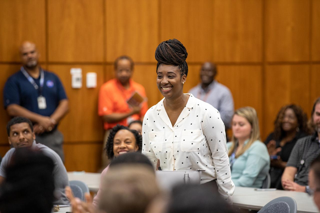 Jakebia Keith, program and contract analyst for the IT Resources Management Office and secretary for the Black Employee Strategy Team (BEST), one of the center’s employee resource groups, stands during recognition at the Black History Month celebration on Feb. 18, 2020, at NASA’s Kennedy Space Center in Florida. The program was organized by BEST. This year’s theme was “African Americans and the Vote.” James Jennings, former NASA associate administrator for Institutions and Management and former Kennedy Space Center deputy director, was keynote speaker at the event.