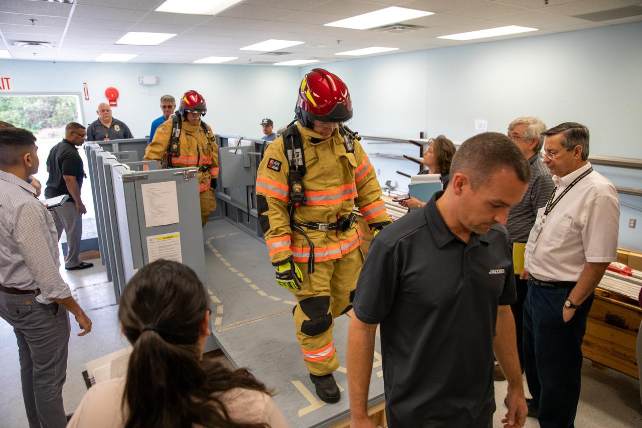 Members of NASA Kennedy Space Center’s Fire Rescue team walk through a mock-up of a launch pad escape basket on Feb. 19, 2020. Kennedy’s prime contractor Reynolds, Smith and Hill presented the mock-up to NASA, fire rescue personnel and other stakeholders at the Florida spaceport. The basket would be utilized at Launch Pad 39B in the unlikely event of an emergency at the pad requiring evacuation during crewed missions under the Artemis Program. The actual egress basket will be designed larger than ones used during the shuttle era in order to accommodate fire rescue crew, astronauts and closeout crew. During the presentation, a fire rescue team conducted a series of trial scenarios and addressed items such as basket release location, seat depth to accommodate firefighters in full gear, sequence of loading and more.