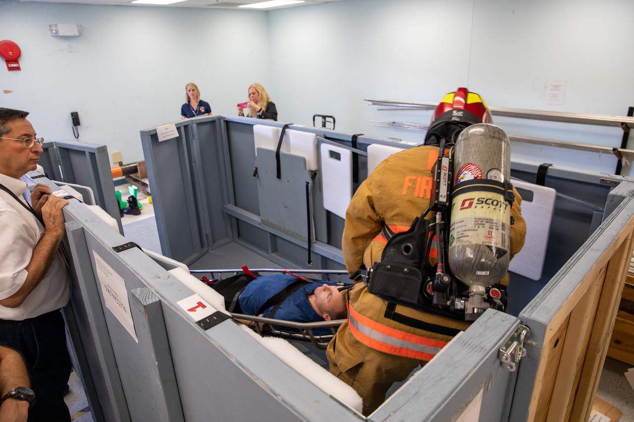 Members of NASA Kennedy Space Center’s Fire Rescue team participate in a series of trial scenarios in a mock-up of a launch pad escape basket on Feb. 19, 2020. Kennedy’s prime contractor Reynolds, Smith and Hill presented the mock-up to NASA, Kennedy Fire Rescue personnel and other stakeholders at the Florida spaceport. The basket would be utilized at Launch Pad 39B in the unlikely event of an emergency at the pad requiring evacuation during crewed missions under the Artemis Program. The actual egress basket will be designed larger than ones used during the shuttle era in order to accommodate fire rescue crew, astronauts and closeout crew. During the presentation, items such as basket release location, seat depth to accommodate firefighters in full gear, sequence of loading and more were addressed. Engineers will take what they learned during this presentation and discussion to advance the design of the pad egress system.
