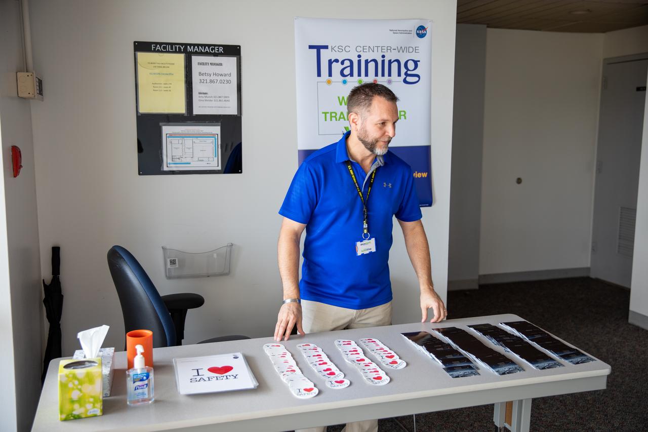 Sean Nichols, a Safety and Mission Assurance employee at NASA’s Kennedy Space Center in Florida, distributes safety favors inside the Training Auditorium on March 2, 2020, during the center’s annual Safety and Health Days. Taking place March 2 through March 6, Safety and Health Days provides Kennedy employees with a variety of presentations to attend – all of which focus on how to maintain a safe and healthy workforce.