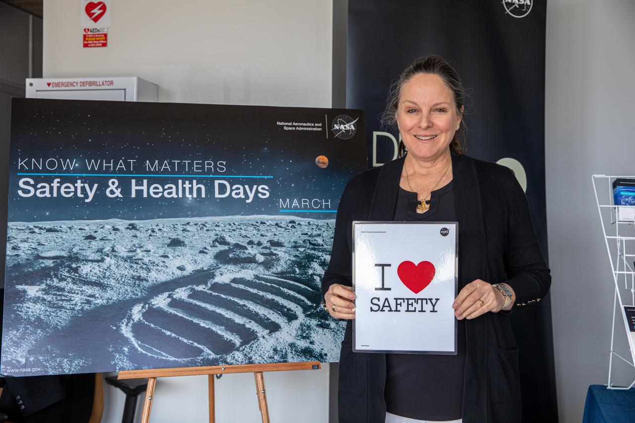 Mary Kirkland, a Kennedy Space Center athletic trainer at RehabWorks and one of the guest speakers during Kennedy’s annual Safety and Health Days, poses with the Safety and Mission Assurance “I Love Safety” poster inside the Training Auditorium on March 2, 2020, prior to her presentation. Taking place March 2 through March 6, Safety and Health Days provides Kennedy employees with a variety of presentations to attend – all of which focus on how to maintain a safe and healthy workforce. Kirkland’s presentation included information on the body’s myofascial system and how daily activity and exercise contributes to its health.