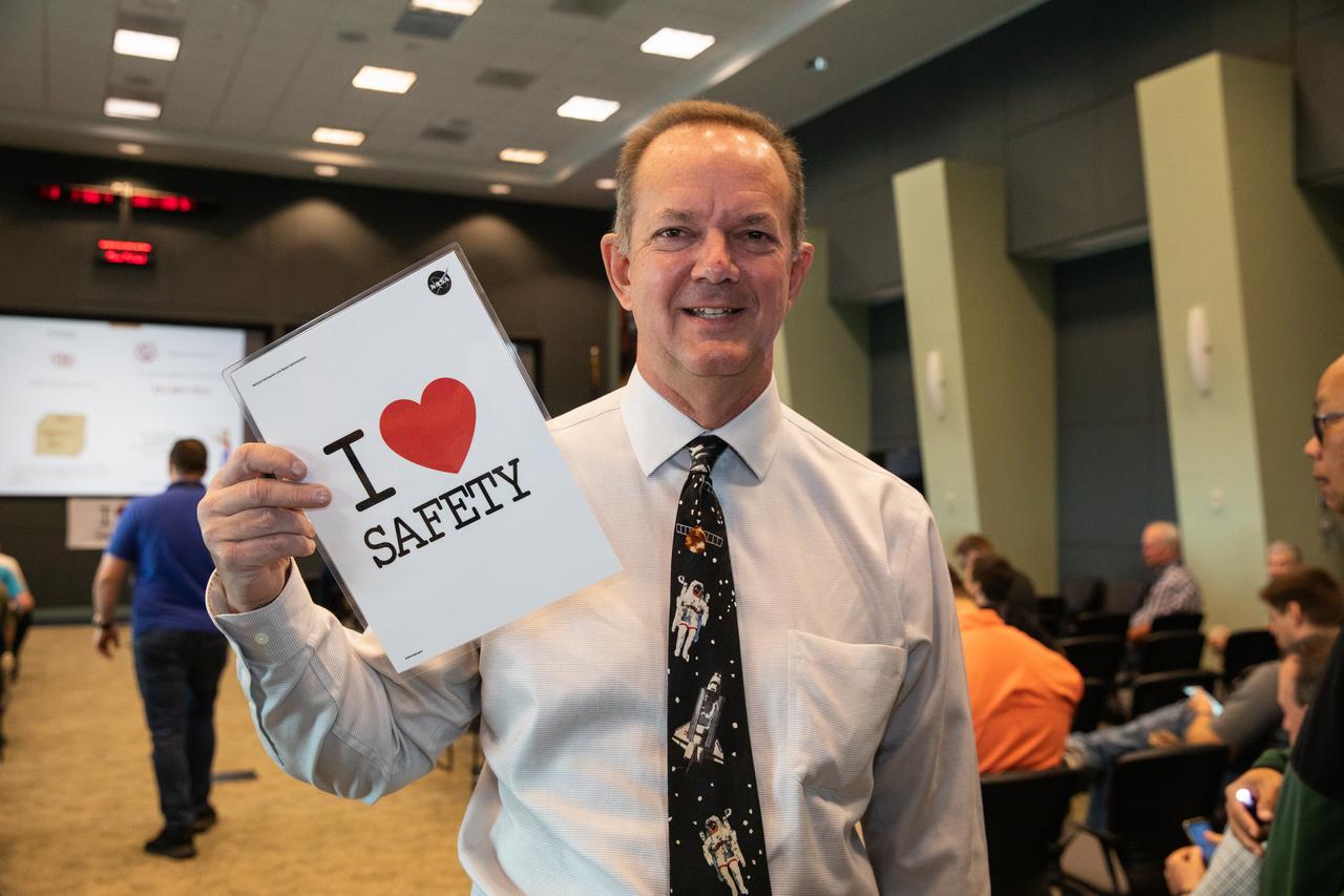 Tom Engler, director of Center Planning and Development at NASA’s Kennedy Space Center in Florida, poses with the Safety and Mission Assurance “I Love Safety” poster during the center’s annual Safety and Health Days on March 3, 2020. Taking place March 2 through March 6, Safety and Health Days provides Kennedy employees with a variety of presentations to attend – all of which focus on how to maintain a safe and healthy workforce.