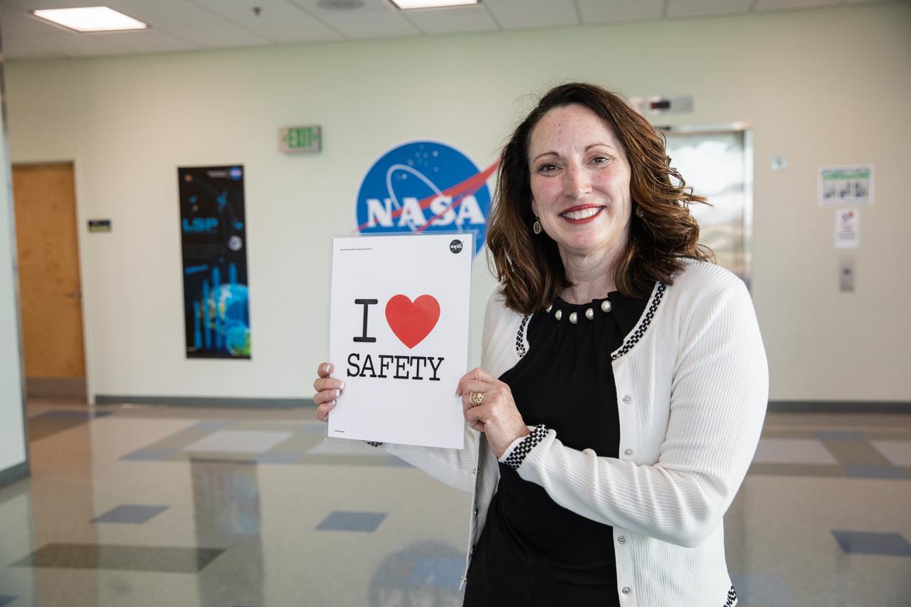 Eliz Greene, one of the guest speakers during NASA Kennedy Space Center’s annual Safety and Health Days, poses with the Safety and Mission Assurance “I Love Safety” poster inside the Operations Support Building II on March 3, 2020, prior to her presentation. Taking place March 2 through March 6, Safety and Health Days provides Kennedy employees with a variety of presentations to attend – all of which focus on how to maintain a safe and healthy workforce. Greene’s presentation included information on reducing stress and improving focus.