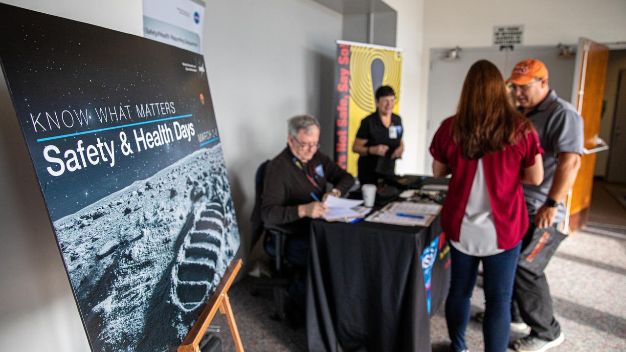 NASA Kennedy Space Center employees learn more about safety from an informational table set up inside the Florida spaceport’s Training Auditorium on March 4, 2020, during the center’s annual Safety and Health Days. Taking place March 2 through March 6, Safety and Health Days provides Kennedy employees with a variety of presentations to attend – all of which focus on how to maintain a safe and healthy workforce.